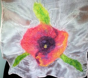 Hemmed silk scarf showing nuno felted single poppy at one end